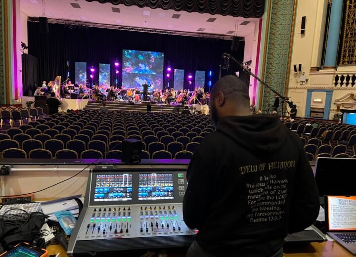 FKLEF Productions engineer at a digital mixing console during a live orchestral production